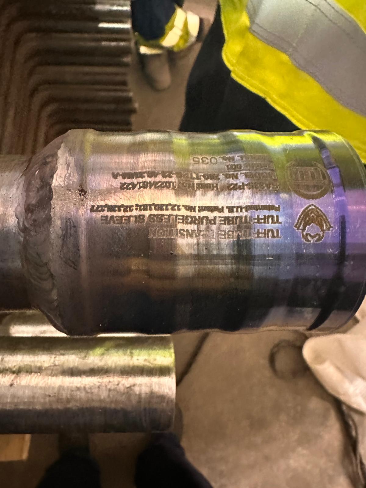 Installed Tuff Tube Purgeless Sleeve with product marking on a tube run at Bouchain