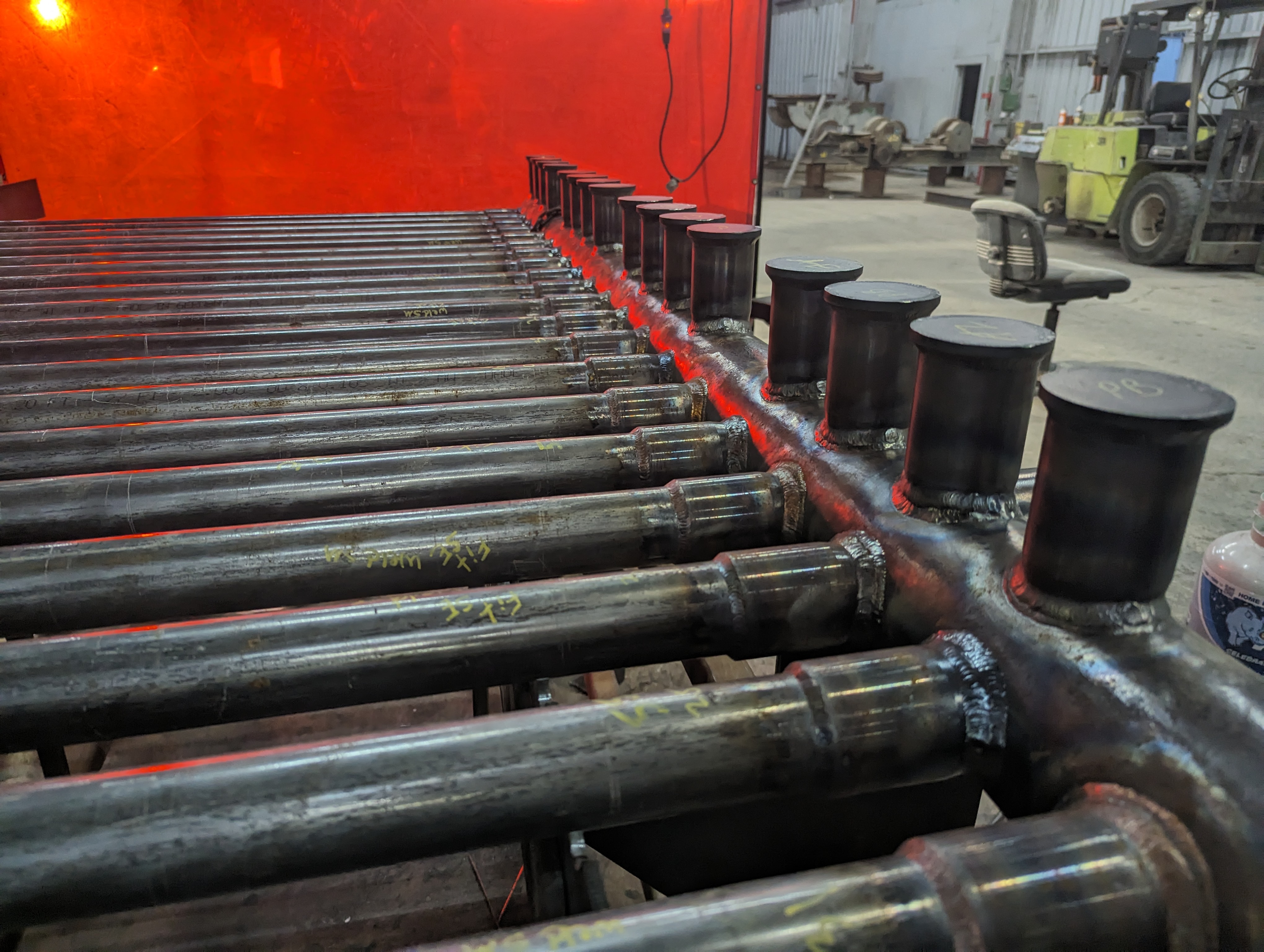 Fabricated header and tube assembly during shop fabrication