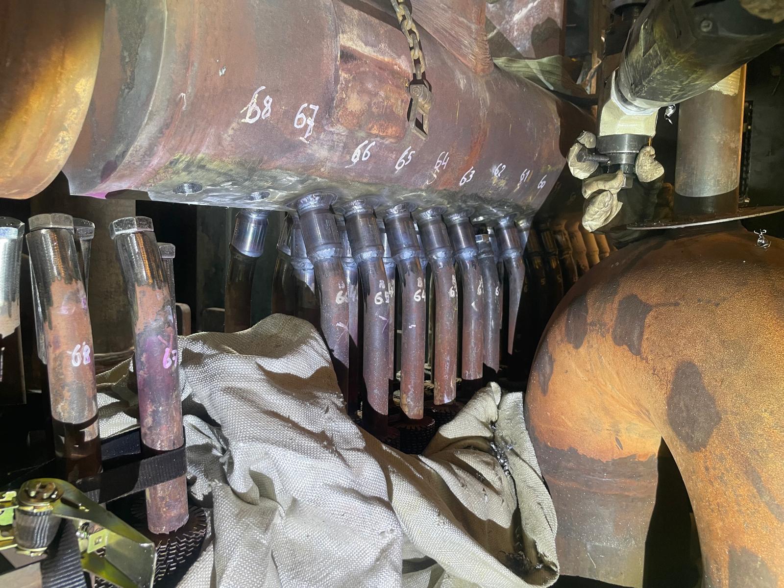 Row of installed Tuff Tube Transition connections across an HRSG tube bank