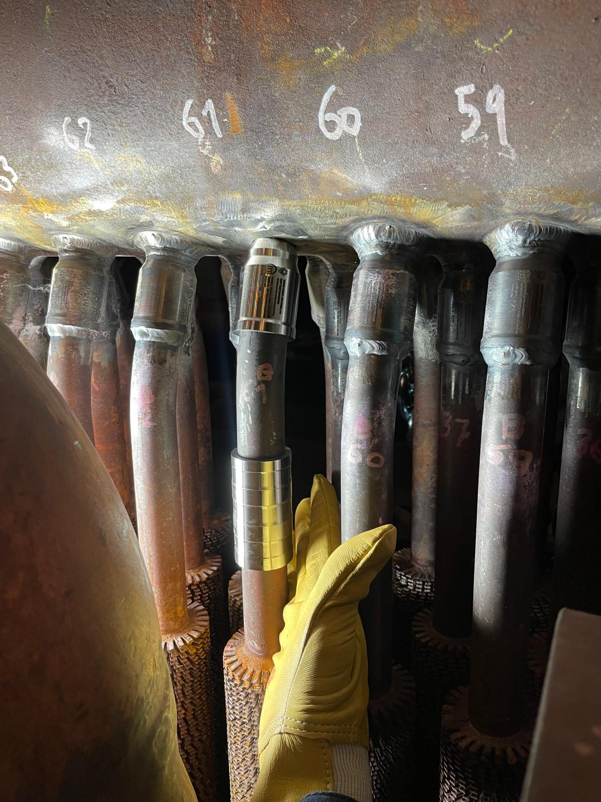 Row of TTHC connections fitted up across a header tube bank